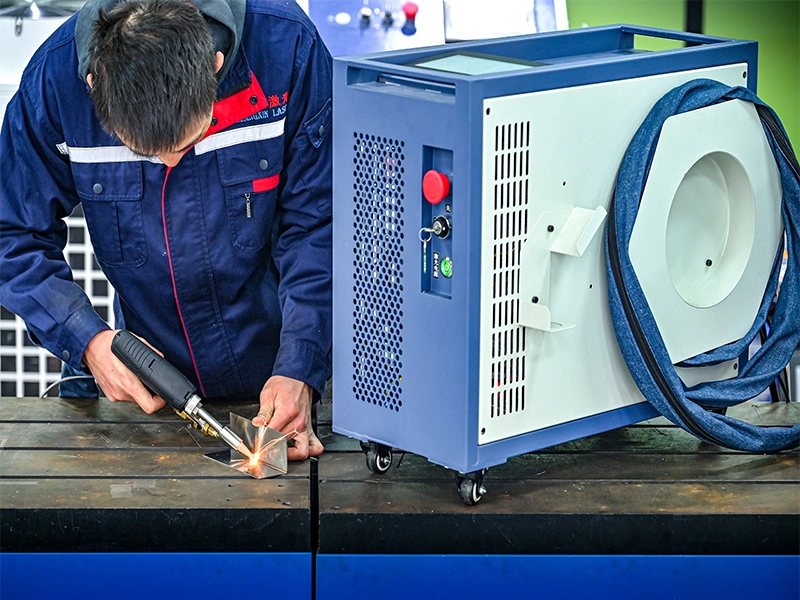 TrueSyn professional team demonstrating handheld laser welder