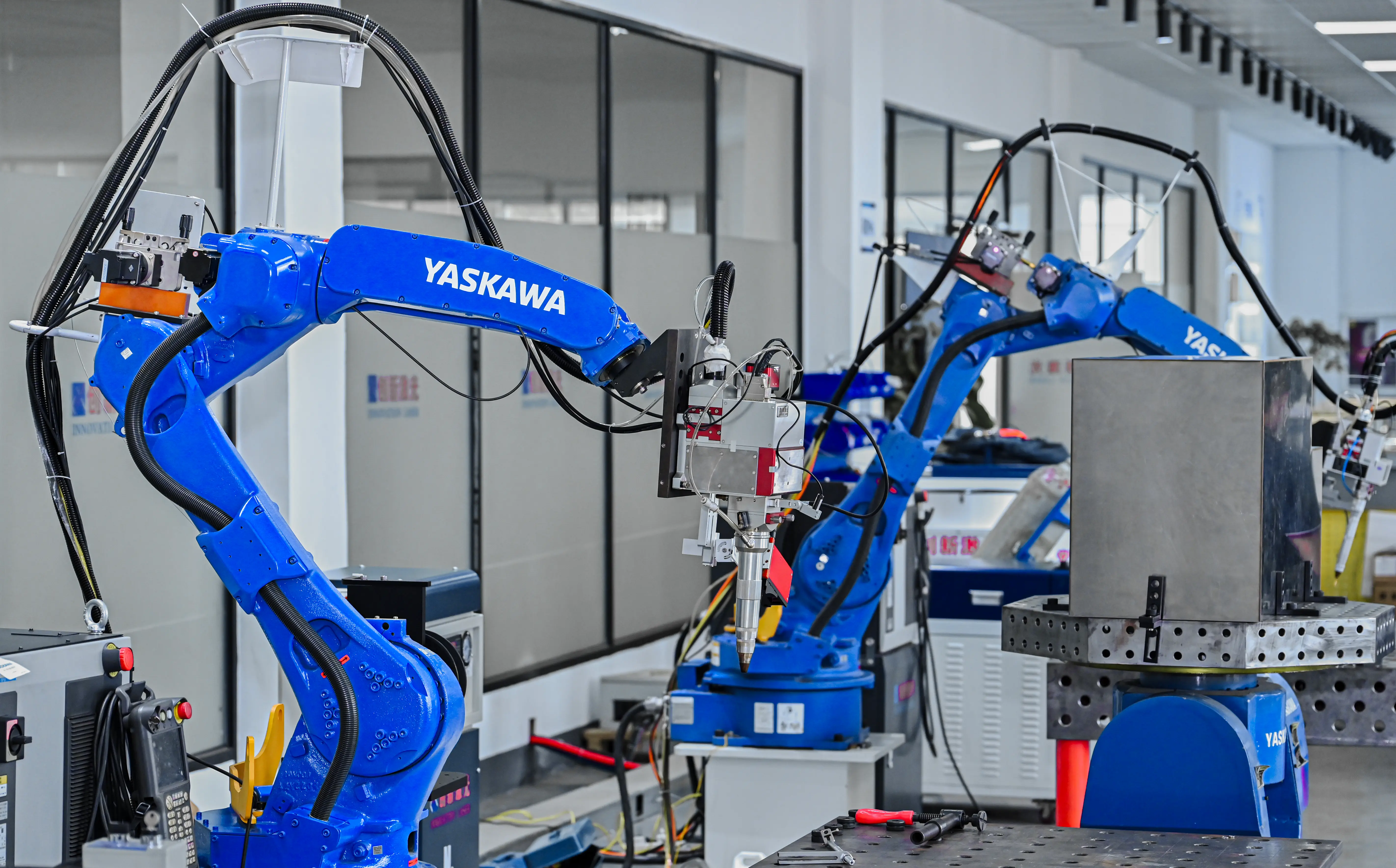 Robot laser welding stations